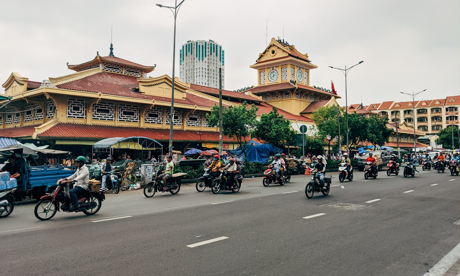 Ho Chi Minh City street scene with motorbike traffic during daytime