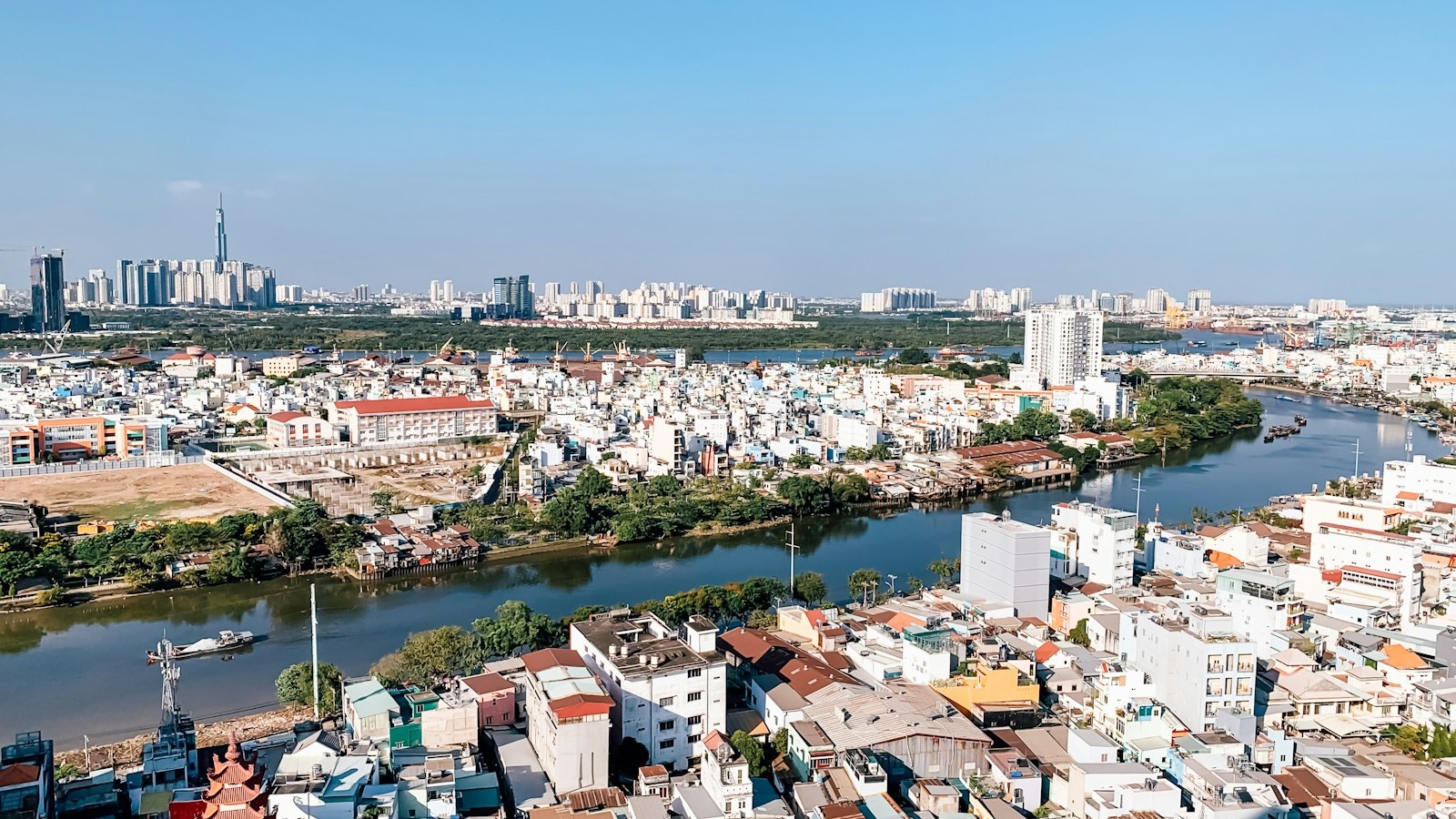 Aerial view of Ho Chi Minh City buildings and the Saigon River during daytime