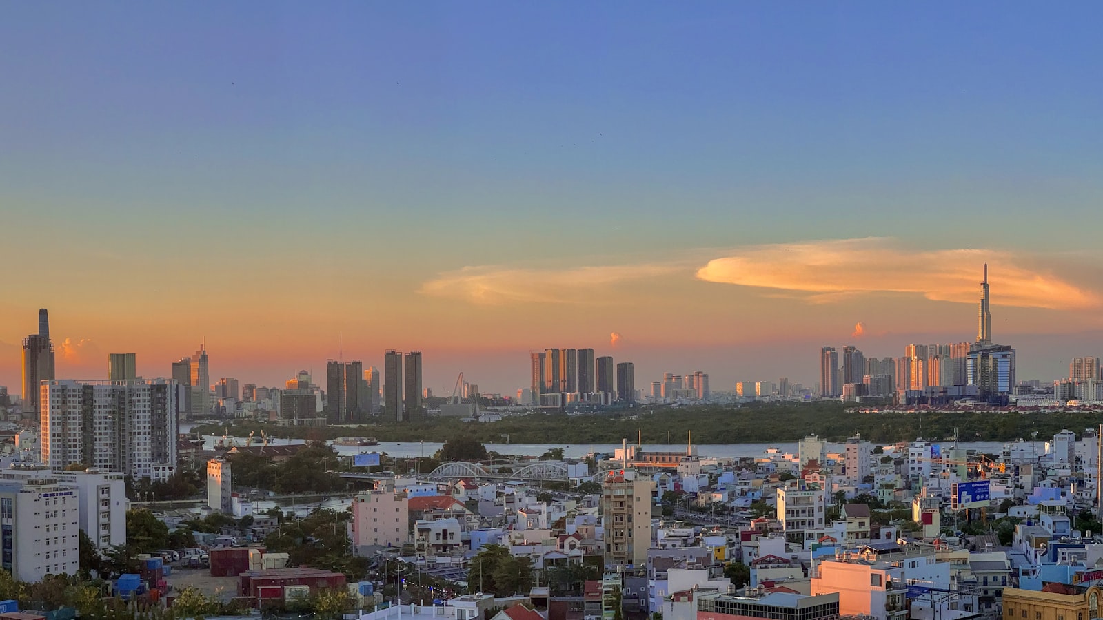 Aerial view of Ho Chi Minh City skyline and river at dusk