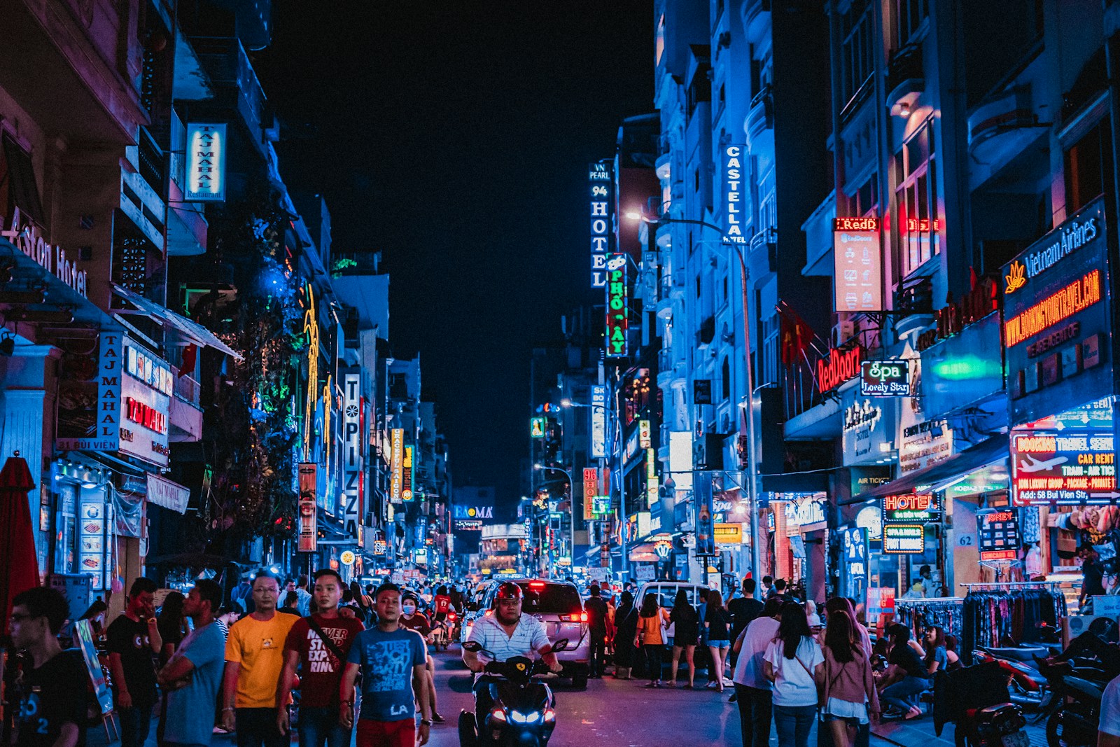 Crowded street scene at night in Ho Chi Minh City, Vietnam