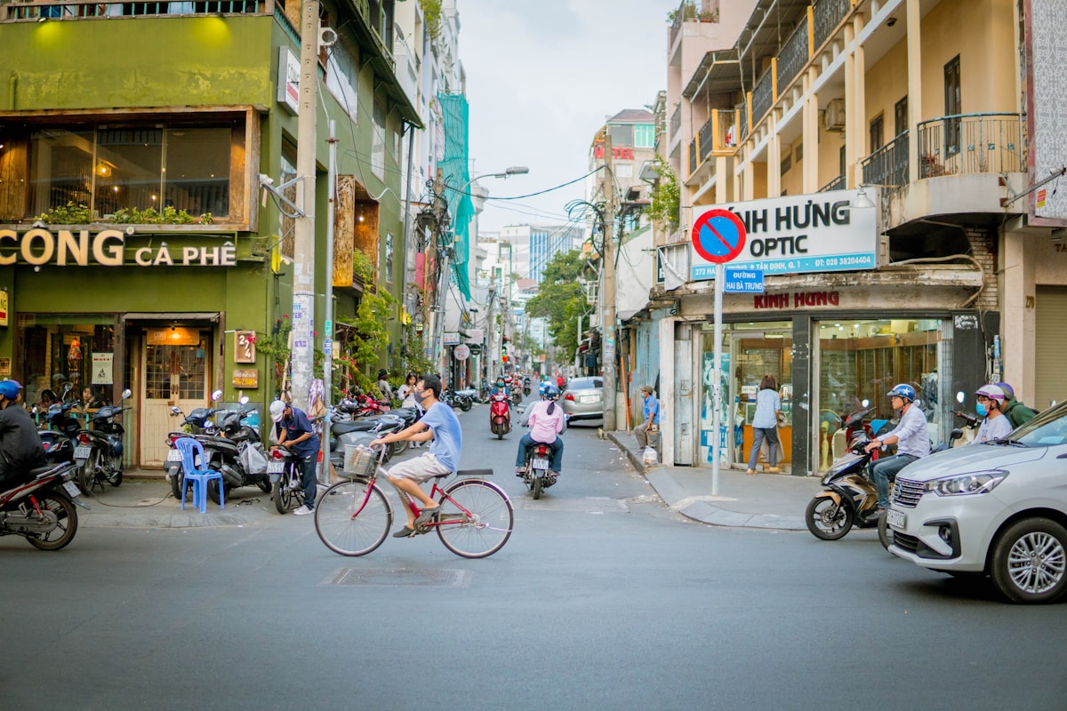 People on motorbikes navigating a busy street in Ho Chi Minh City