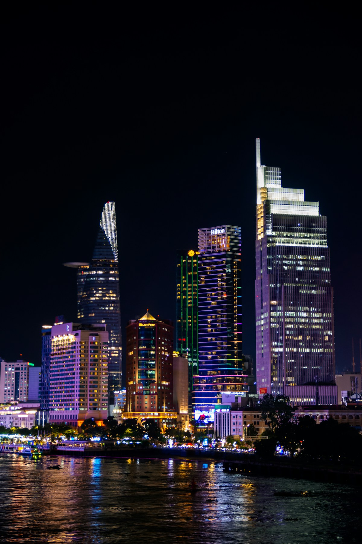 Illuminated skyscrapers of Ho Chi Minh City central business district at night